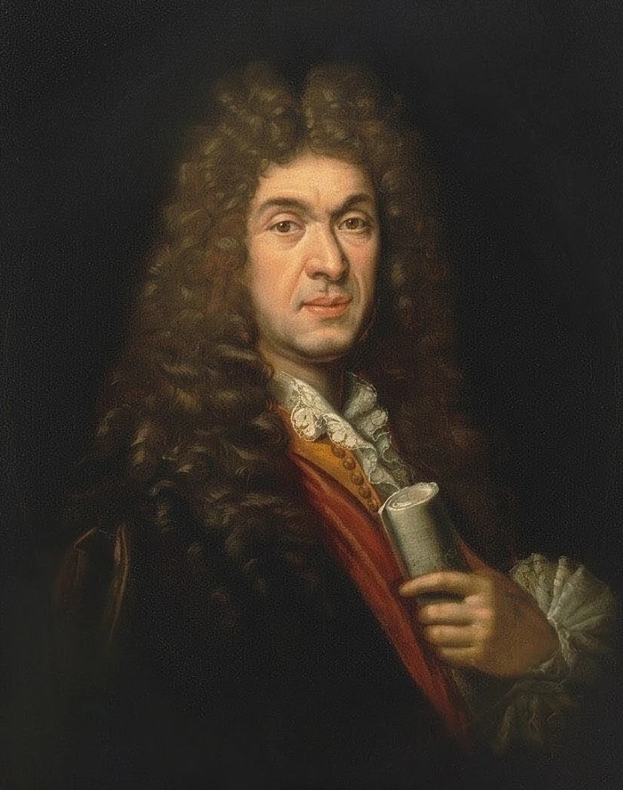 Portrait de Jean-Baptiste Lully en buste, grande perruque et manteau rouge, tenant un rouleau de musique, par Paul Mignard